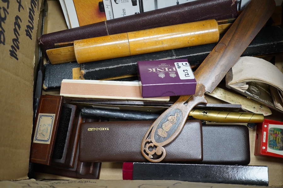 A collection of writing accessories including rulers, scientific rulers, paper knives, a Mauchline ware pencil case, pen nibs, etc. Condition - fair